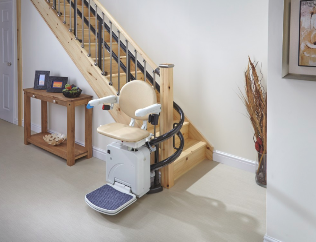 Handicare 2000 curved stairlift at the bottom of the stairs