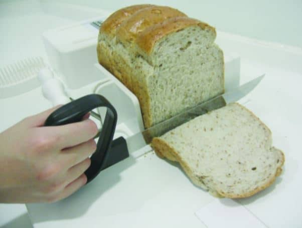 Cutting bread on a food workstation