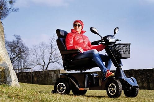 a lady on the Sterling S700 mobility scooter a lady on the Sterling S700 mobility scooter